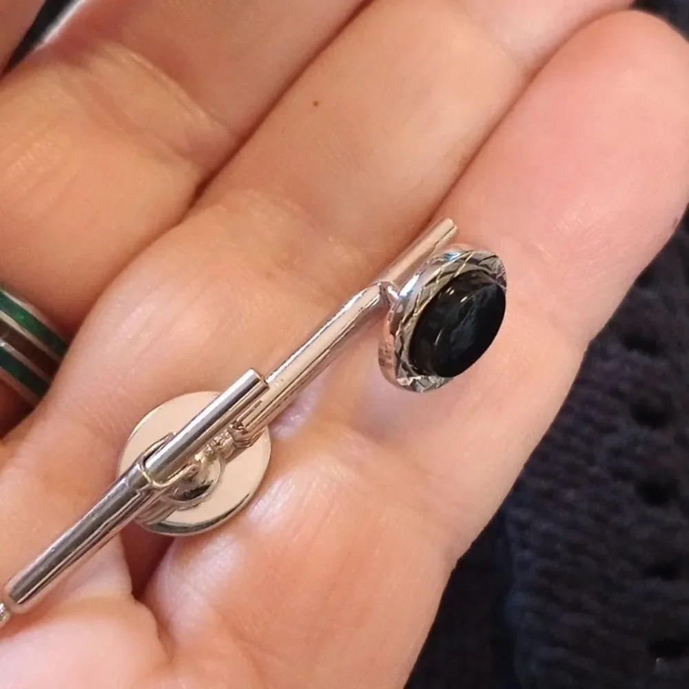 Pair of black and silver cufflinks